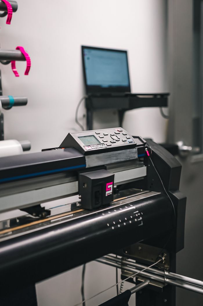 services-01 Close-up of modern printing machine in a professional studio environment.